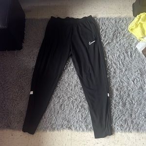 Black w/ white stripe Nike dri-fit pants, size L